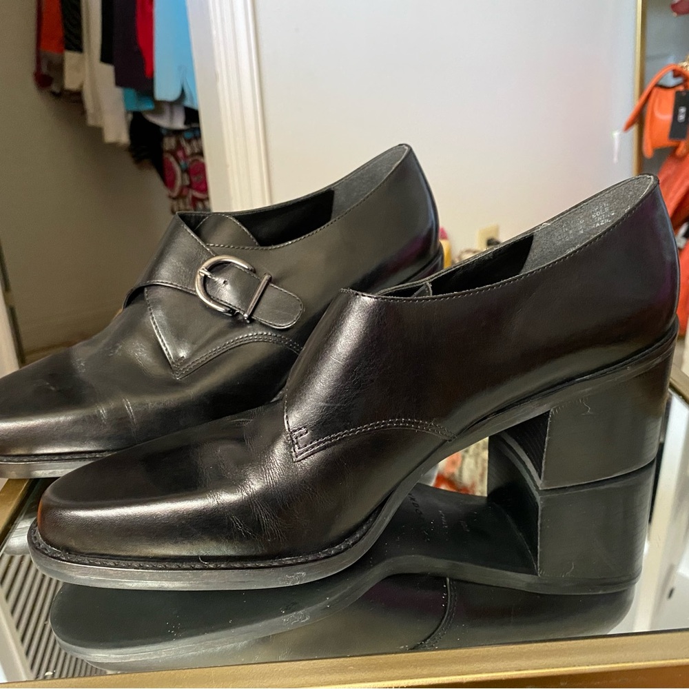 Bandolino Black buckle loafers.
